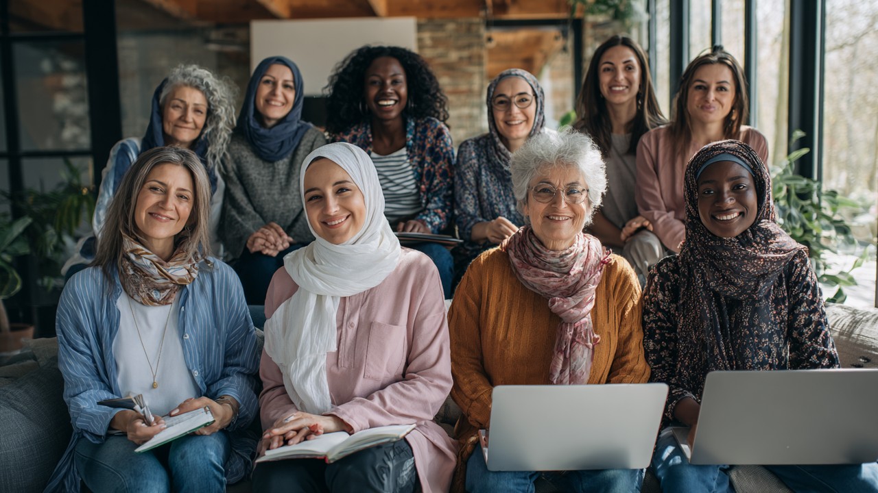 Diverse Turkish women of various ages learning online at home with laptops, notebooks, in a cozy, well-lit environment, symbolizing empowerment through education.
