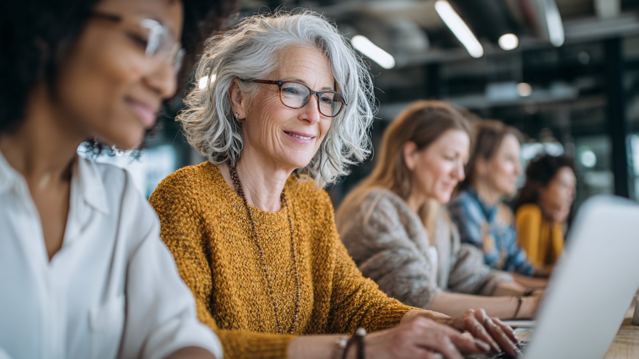 Diverse Turkish women of various ages studying online with laptops and tablets in a bright, modern home setting, showcasing empowerment.
